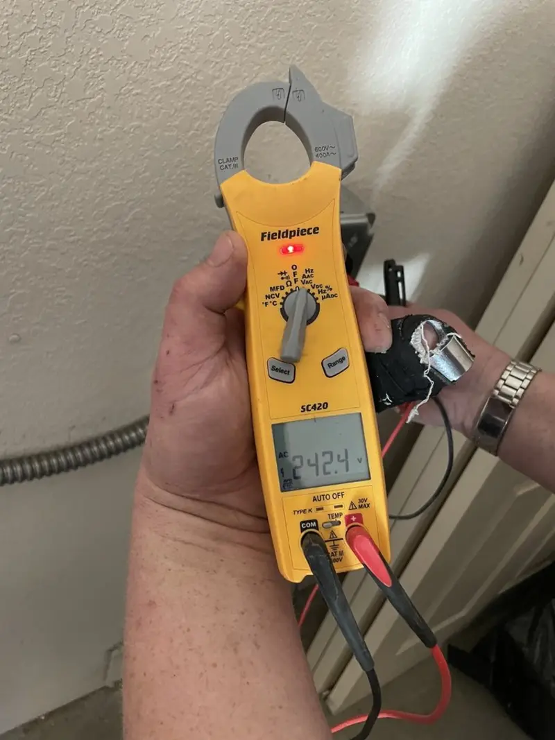 Voltage testing with clamp meter during Outlet Installation in Alhambra